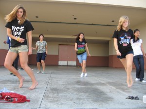 Juniors Kristina Becker, Alex Drachnik, Erin Enguero, Krystal Inman, and Amber Yao practice one of the dances that will be in their skit on November 2.This picture expresses the rule of thirds, leading lines, repetition of shapes, a peak of emotion, and a depth of field.